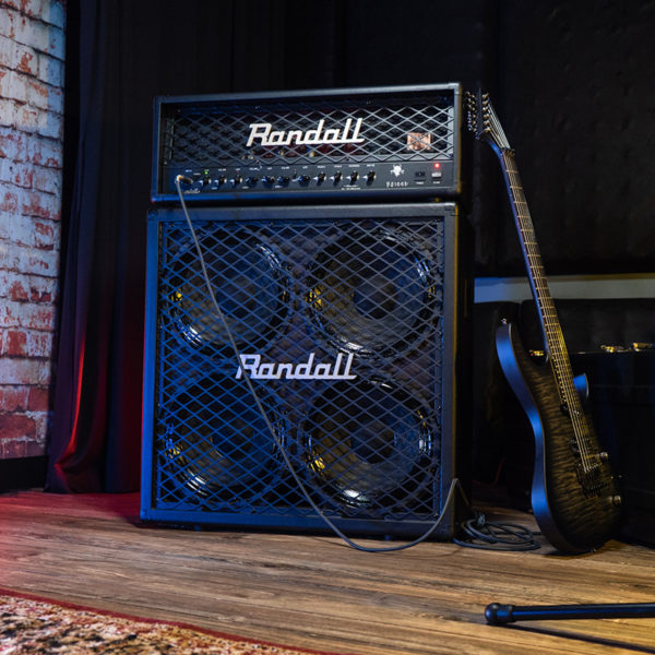 black Randall amplifier beside electric guitar