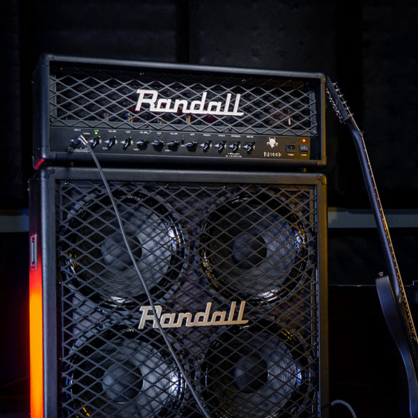 electric guitar leaning on Randall amplifier with amplifier head